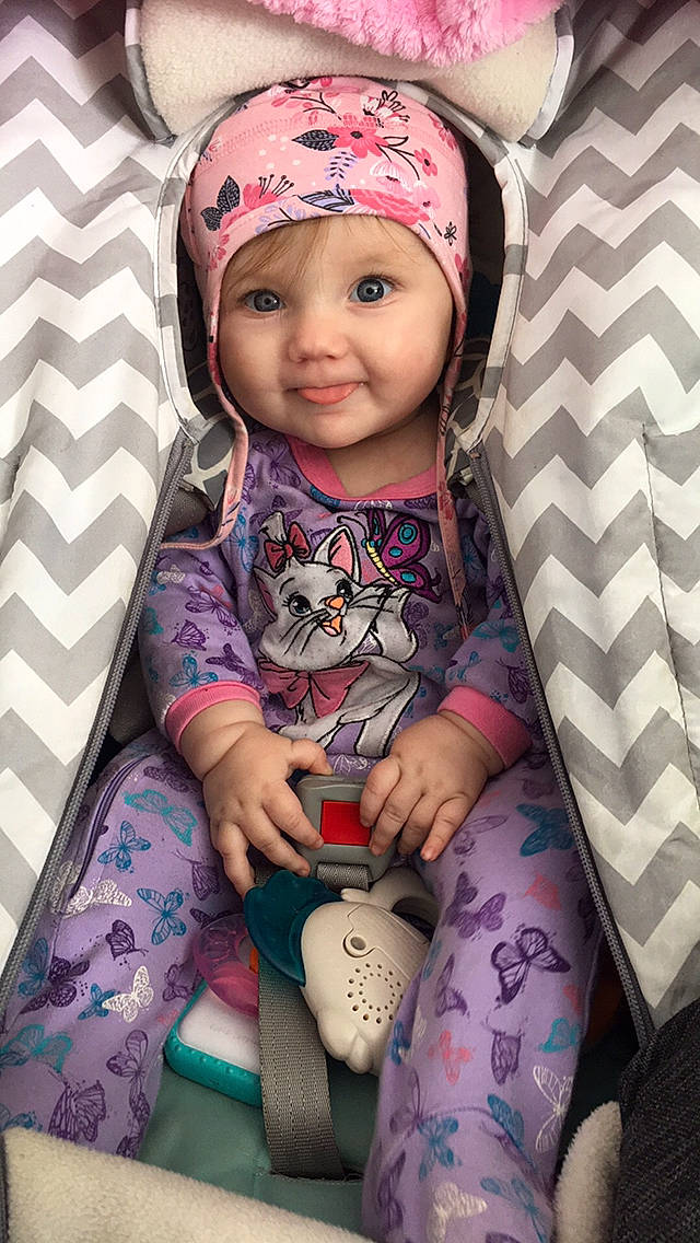 Aurély a rejoint le concours — aidez-le/la à gagner de superbes lots ! baby, baby_carriage, baby_toddler_clothing, cap, cheek, cool, eye, face, happy, head, headwear, human_body, joy, lip, outerwear, person, pink, purple, skin, sleeve