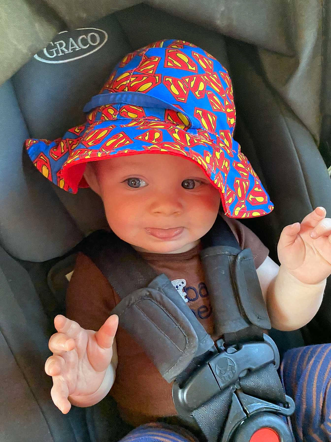 Tylan joined the competition — help win amazing prizes! baby, baby_toddler_clothing, baseball_cap, cap, car_seat, eye, finger, fun, gesture, hand, happy, hat, head, headwear, person, product, sleeve, smile, sun_hat, thumb