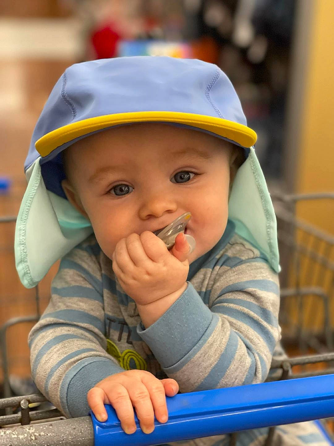 Tylan is registered to the contest to win money with this photo: baby, cap, child, facial_expression, fashion_accessory, fun, grass, happy, hat, headwear, helmet, leisure, people, person, personal_protective_equipment, play, recreation, sitting, skin, smile