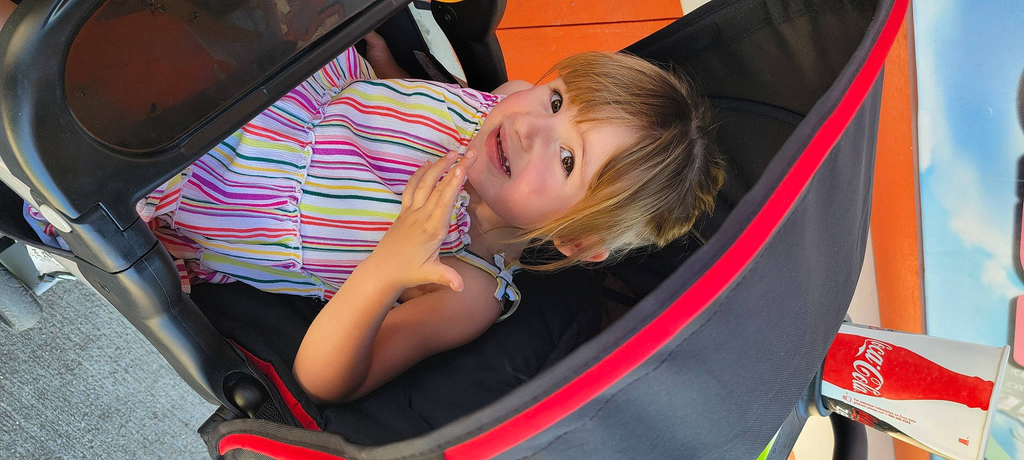 Gemma joined the competition — help win amazing prizes! auto_part, automotive_design, automotive_exterior, bag, blond, bumper, car_seat, child, comfort, fun, human_leg, leisure, luggage_and_bags, motor_vehicle, person, smile, thigh, toddler, tree, vehicle
