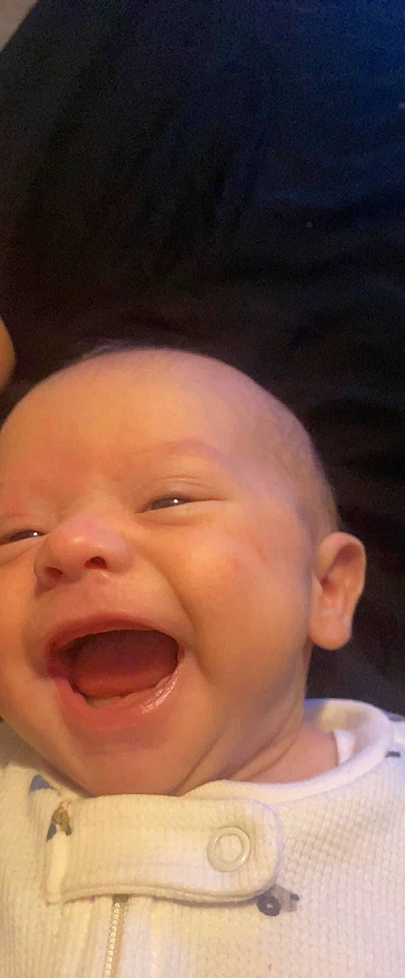 Ruger is registered to the contest to win money with this photo: baby, cheek, chin, ear, eye, eyebrow, eyelash, face, forehead, head, human_body, jaw, lip, mouth, neck, nose, person, skin, smile, tongue