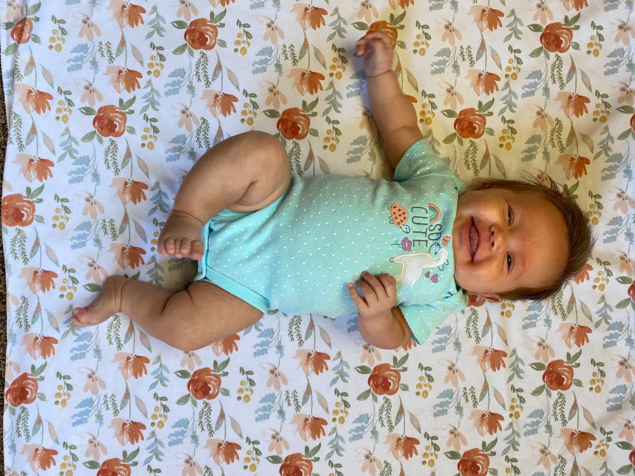 Ellie is registered to the contest to win money with this photo: arm, baby, baby_sleeping, baby_toddler_clothing, bedding, child, comfort, glasses, hand, happy, human_leg, joy, linens, pattern, person, pink, room, skin, sleeve, t_shirt