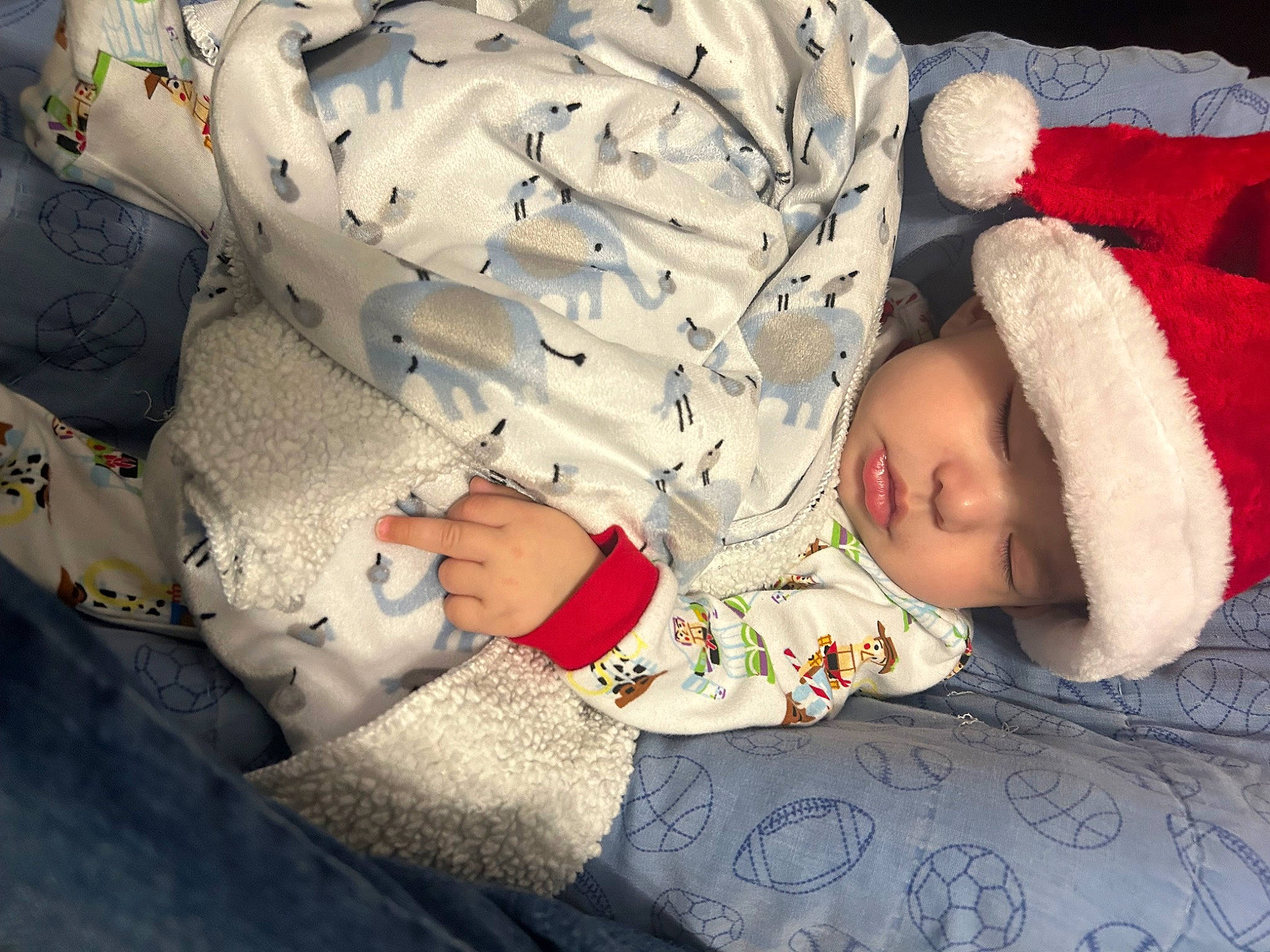 Josiah is registered to the contest to win money with this photo: baby, baby_products, baby_sleeping, baby_toddler_clothing, bedtime, carmine, cheek, child, comfort, fur, headwear, knit_cap, linens, nap, pattern, person, room, sitting, sleep, sleeve