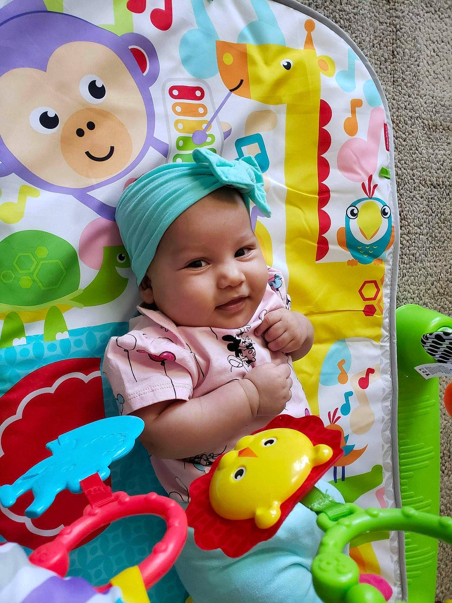 Khyha is registered to the contest to win money with this photo: art, baby, baby_playing_with_toys, baby_products, baby_toddler_clothing, baby_toys, cheek, child, facial_expression, fun, green, happy, headwear, person, pink, product, smile, stuffed_toy, textile, toddler