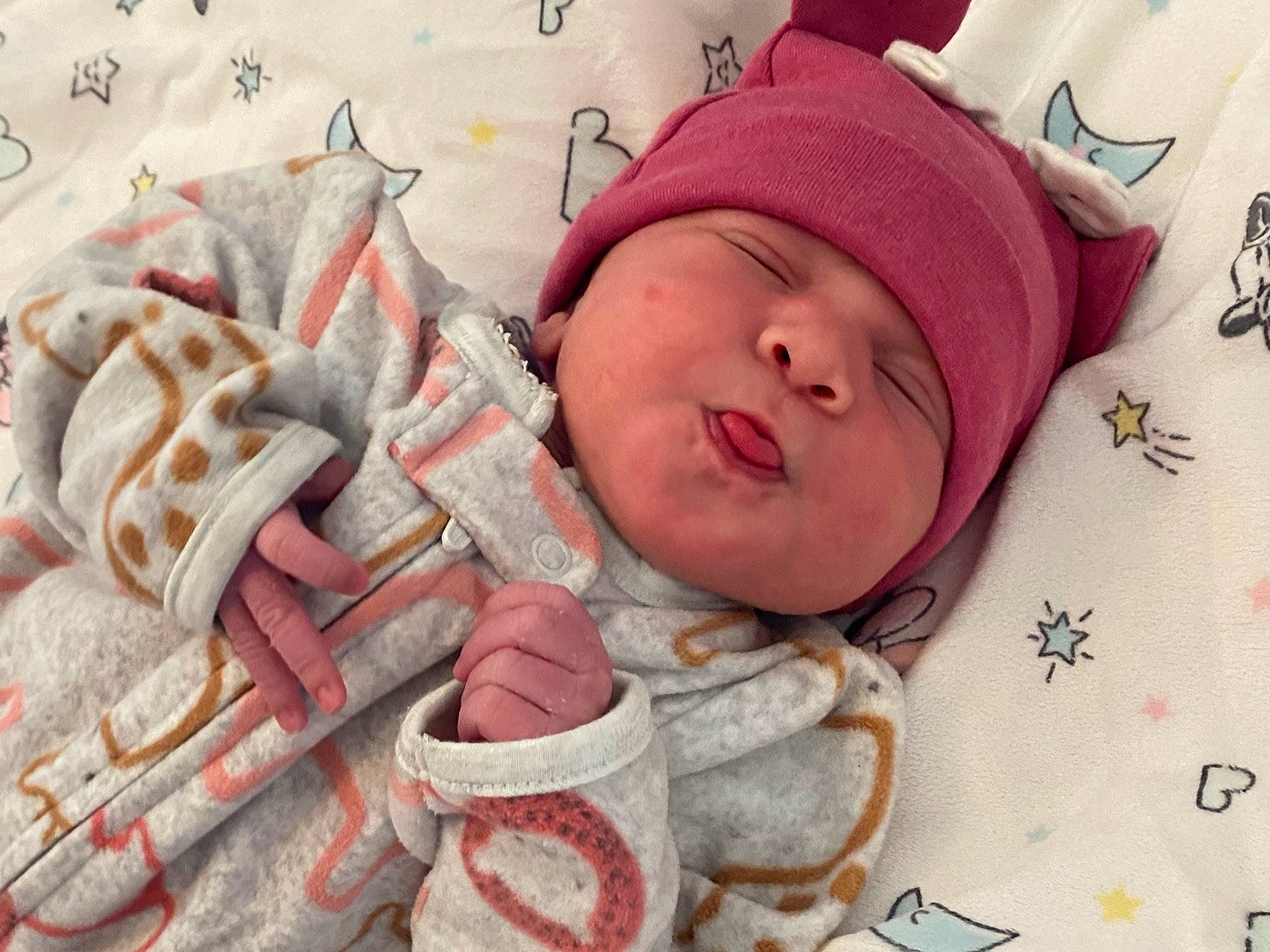 Khyha is registered to the contest to win money with this photo: baby, baby_products, baby_safety, baby_sleeping, baby_toddler_clothing, cap, carmine, cheek, child, comfort, drinkware, headgear, headwear, knit_cap, linens, pattern, peach, person, pink, skin