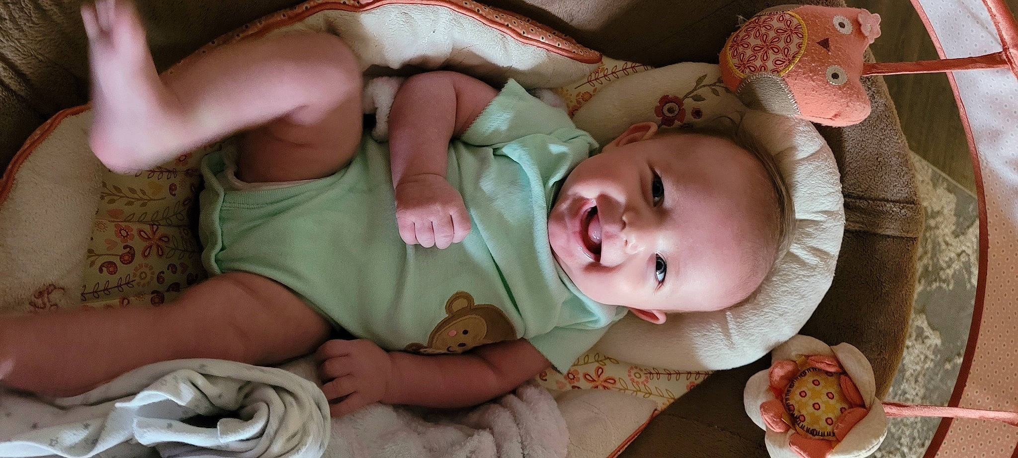 Raven is registered to the contest to win money with this photo: baby, baby_toddler_clothing, cheek, comfort, dress, eye, face, finger, hand, head, human, human_body, iris, lip, mouth, nose, person, pink, skin, smile