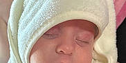 Jaycee joined the competition — help win amazing prizes! baby, sleeping, towel, hood, bear_design, soft_texture, closeup, face, child, infant, cute, wrapped, pink_background, calm, peaceful, skin, mouth, nose, eyelashes, blanket