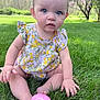 baby, child, grass, outdoor, flowered_dress, pink_egg, sitting, greenery, nature, cute, blue_eyes, skin, hand, foot, summer, spring, playful, portrait, infant, sunlight