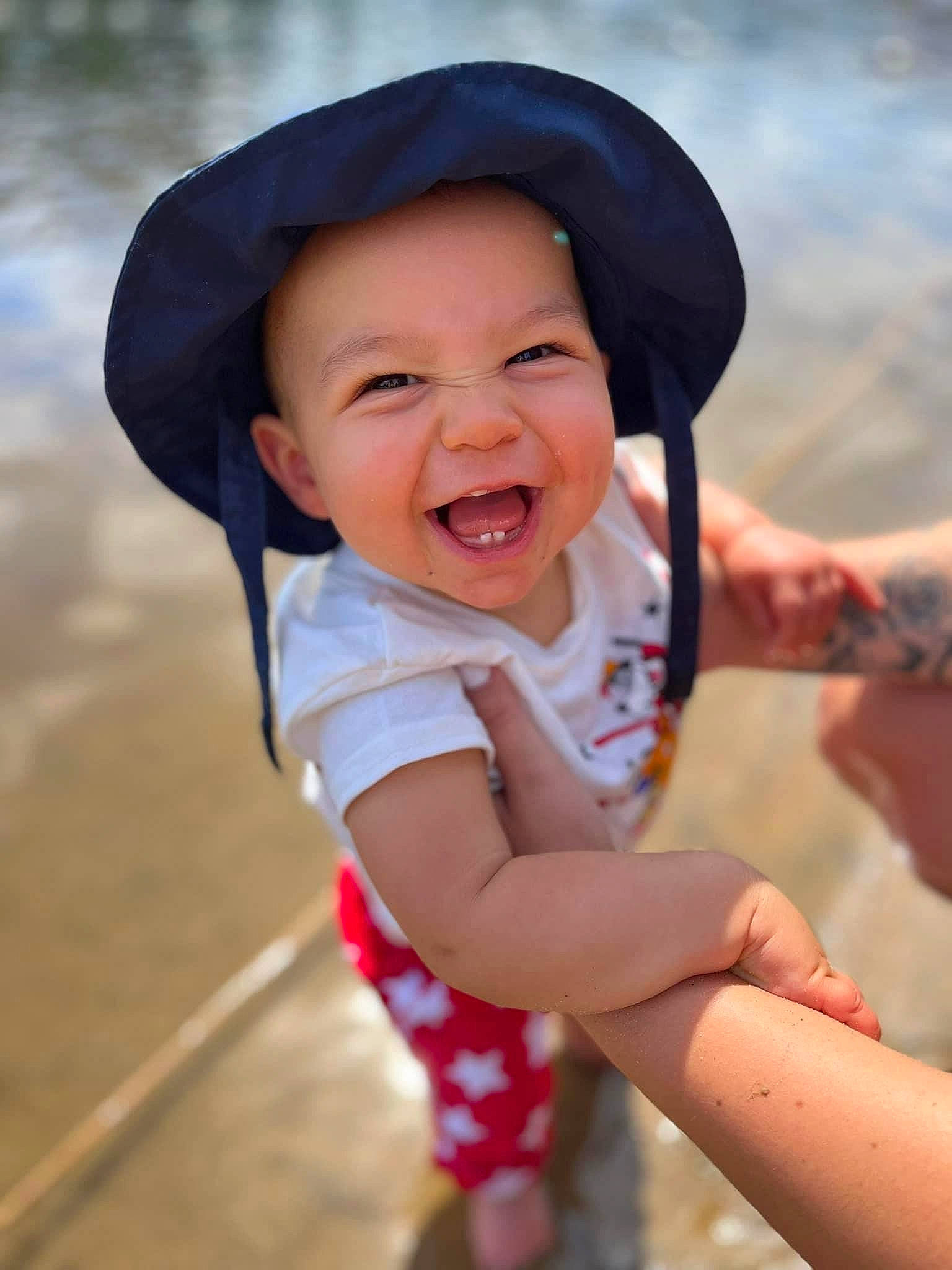 Emilio joined the competition — help win amazing prizes! cap, eye, facial_expression, finger, flash_photography, fun, gesture, hand, happy, hat, head, headwear, human_body, lip, mouth, people_in_nature, person, recreation, sand, skin