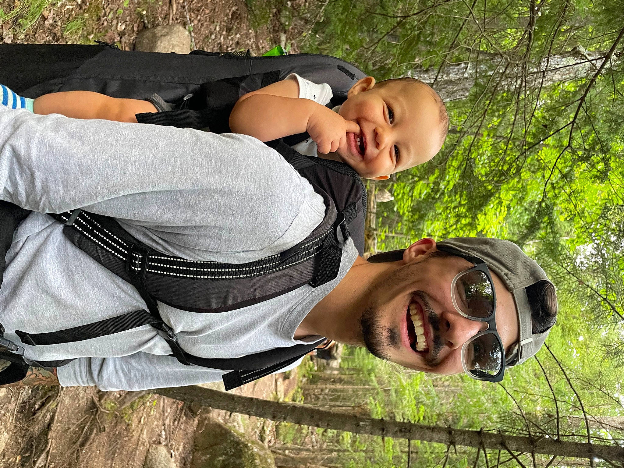 Emilio is registered to the contest to win money with this photo: child, eyewear, face, fun, glasses, grass, hand, happy, hat, head, headwear, joy, leisure, people, people_in_nature, person, plant, recreation, smile, sunglasses