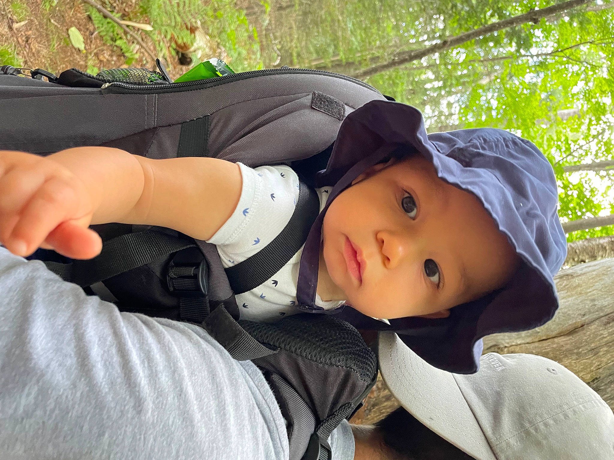 Emilio joined the competition — help win amazing prizes! baseball_cap, cap, chest, comfort, cool, elbow, fashion_accessory, grass, hat, headwear, human_leg, knee, leisure, people_in_nature, person, plant, sitting, smile, sun_hat, thigh