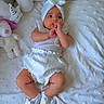 Liya joined the competition — help win amazing prizes! baby, infant, white_clothing, headwrap, socks, plush_toys, bed, blanket, soft_texture, cute, lying_down, indoors, child, adorable, small_hands, sleeping_area, comfort, peaceful, portrait, looking_away