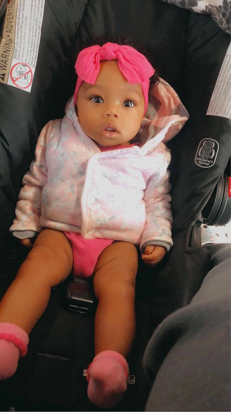 Leilani joined the competition — help win amazing prizes! baby, cap, cheek, child, comfort, doll, eye, eyelash, finger, headwear, lap, lip, magenta, mouth, person, pink, shorts, skin, textile, thigh