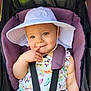baby, child, stroller, hat, white_hat, purple_stroller, colorful_clothing, butterflies, birds, cute, smiling, playing, finger_on_lips, seatbelt, outdoor, summer, sunhat, infant, portrait, happy
