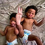 baby, bare_chest, blanket, child, cute, diaper, expression, face, foot, funny, hair, indoor, infant, lying_down, motion_blur, person, playful, skin, toddler, two_people