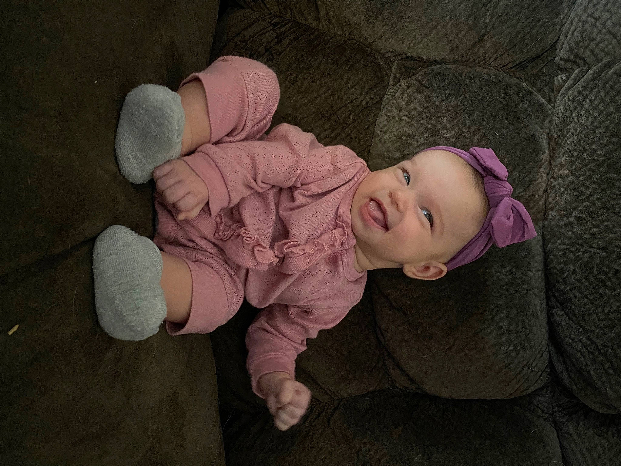 Joslyn is registered to the contest to win money with this photo: baby, baby_toddler_clothing, cheek, child, comfort, eye, flash_photography, floor, flooring, foot, fun, grass, mouth, nose, person, sitting, skin, sleeve, smile, toddler