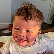 Josiah joined the competition — help win amazing prizes! child, toddler, smiling, curly_hair, indoor, tshirt, face, happy, person, portrait, cute, baby, light, expression, skin, hair, mouth, eyes, clothing, room