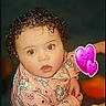 baby, child, curly_hair, cute, digital_emojis, expression, eyes, face, heart_pattern, indoor, infant, looking_up, onesie, pink_clothing, portrait, purple_hearts, sitting, skin, unicorn_pattern, young