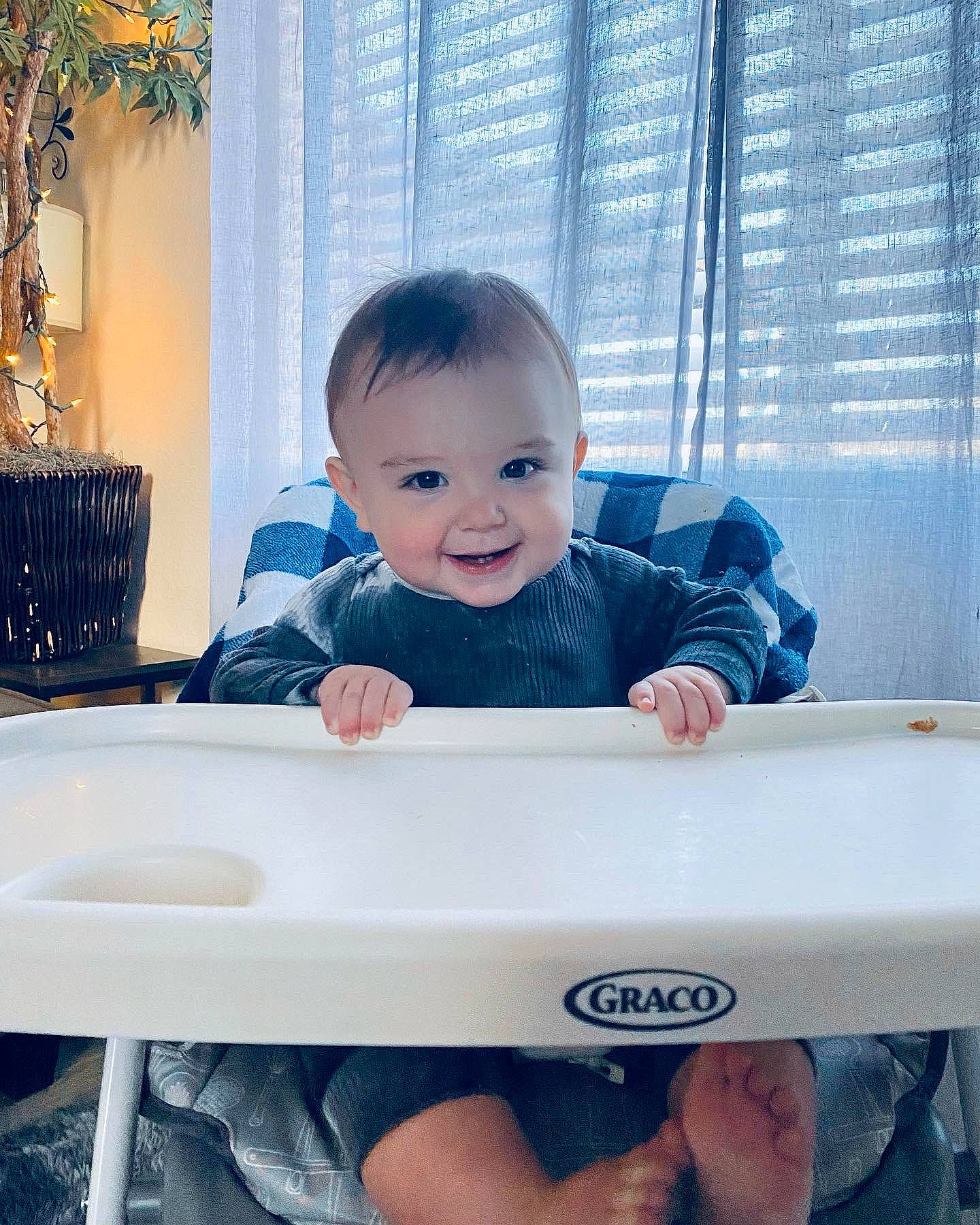 Bradley is registered to the contest to win money with this photo: arm, baby, baby_toddler_clothing, blue, child, electric_blue, facial_expression, fun, hand, happy, joy, person, photograph, product, sitting, skin, sleeve, smile, standing, t_shirt