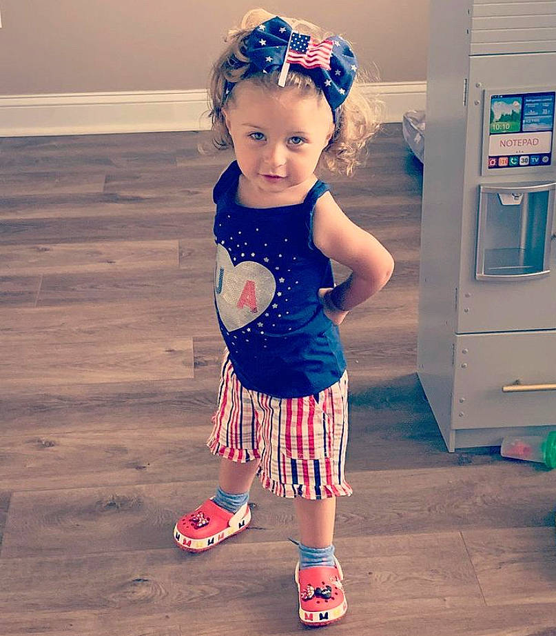Nicoletta joined the competition — help win amazing prizes! baby, baby_toddler_clothing, child, child_model, clothing, day_dress, foot, hair_accessory, headband, headpiece, headwear, machine, mouth, person, pink, sock, tiara, toddler, wood_flooring