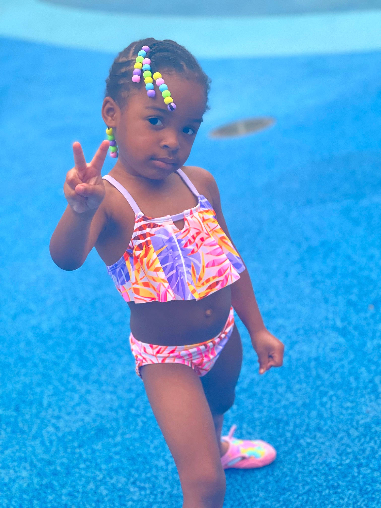 Sariyah is registered to the contest to win money with this photo: abdomen, azure, baby, baby_toddler_clothing, blue, child, electric_blue, eye, flooring, fun, happy, human_leg, leisure, one_piece_swimsuit, pattern, person, recreation, thigh, toddler, trunk