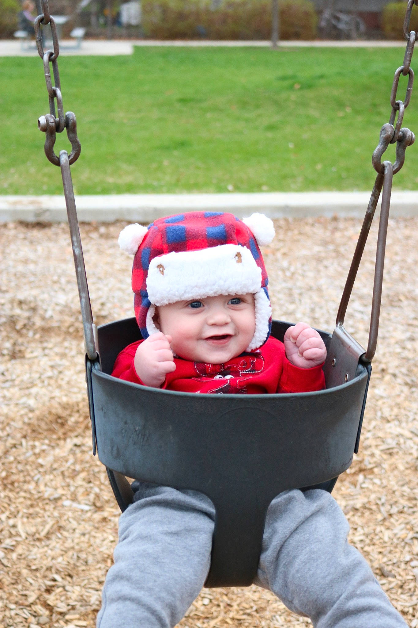 Gideon is registered to the contest to win money with this photo: baby, baby_products, child, headwear, outdoor_play_equipment, person, play, playground, product, smile, swing, toddler