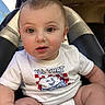 Jasper joined the competition — help win amazing prizes! baby, child, infant, car_seat, car_interior, portrait, close_up, sitting, curious, wide_eyes, round_cheeks, brown_hair, white_shirt, graphic_shirt, diaper, vehicle, leather_seat, sunlight, outdoor, safe