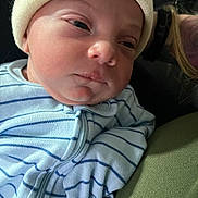 Jasper is registered to the contest to win money with this photo: baby, newborn, infant, sleepy, beanie, clothing, striped, onesie, face, person, portrait, closeup, soft, cozy, skin, headwear, young, child, cute, indoors