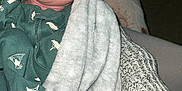 Jasper is registered to the contest to win money with this photo: baby, newborn, sleeping, blanket, hand, person, clothing, knitwear, heart_pattern, cozy, soft, infant, sleep, wrapped, cute, resting, human, closeup, indoor, warm