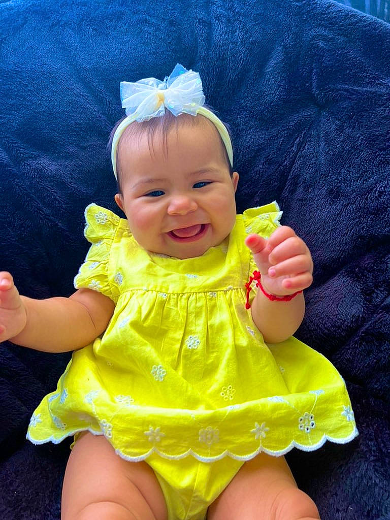Ariana joined the competition — help win amazing prizes! baby, baby_toddler_clothing, cheek, day_dress, eye, finger, gesture, happy, head, headgear, iris, person, pink, purple, skin, sleeve, smile, thumb, toddler, white