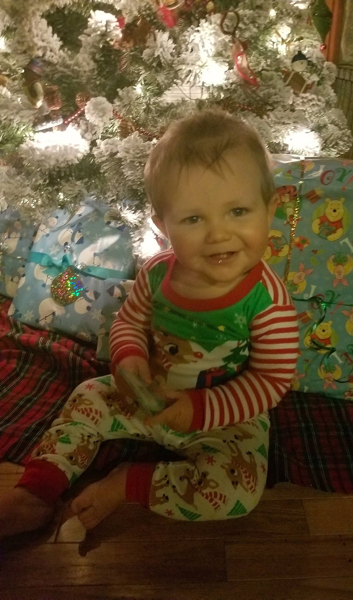 Diesel is registered to the contest to win money with this photo: child, christmas, girl, holiday, infant, iris, joy, person, play, skin, smile, textile, toddler, tree, vertebrate