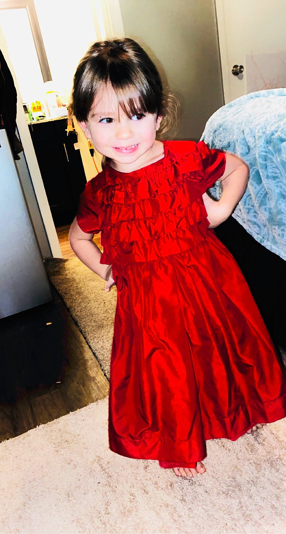 Riley is registered to the contest to win money with this photo: black, black_hair, bridal_party_dress, day_dress, dress, embellishment, fashion_design, flooring, formal_wear, fun, gown, hairstyle, happy, joy, one_piece_garment, person, pink, skin, sleeve, smile