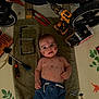 baby, child, denim_pants, drill, expression, face, floor_mat, handyman, indoor, laying_down, messy, nails, number_six, person, playful, pliers, screwdriver, screws, tools, towel