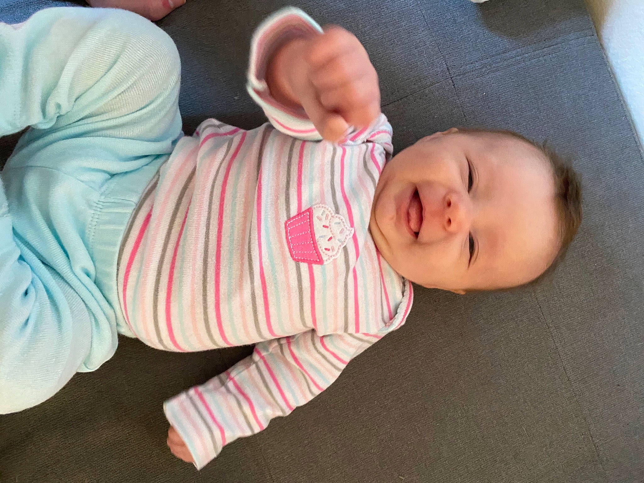 Savannah is registered to the contest to win money with this photo: baby, baby_products, baby_toddler_clothing, cheek, comfort, finger, foot, gesture, headgear, human_body, leg, lip, mouth, nail, nose, pattern, person, skin, sleeve, smile