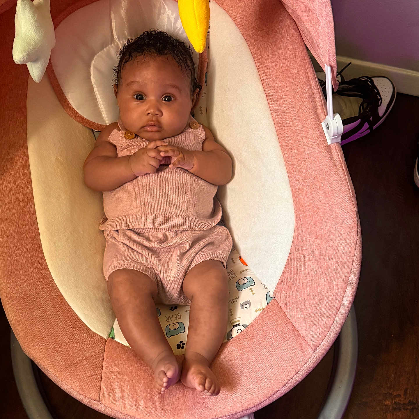 Legacy joined the competition — help win amazing prizes! baby, baby_rocker, child, clothing, curly_hair, cute, expression, face, feet, hands, indoor, infant, kidsview, person, pink_outfit, plush_toy, relaxing, seat, toy, wooden_floor