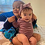 baby, child, siblings, smiling, headband, onesie, bed, blanket, window_blinds, indoor, happy, cute, family, holding_hands, toddler, person, clothing, skin, face, young