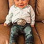 Stetson joined the competition — help win amazing prizes! baby, child, smiling, couch, leather, belt_buckle, shirt, plaid, jeans, shoes, happy, sitting, indoor, portrait, cute, infant, face, clothing, footwear, person