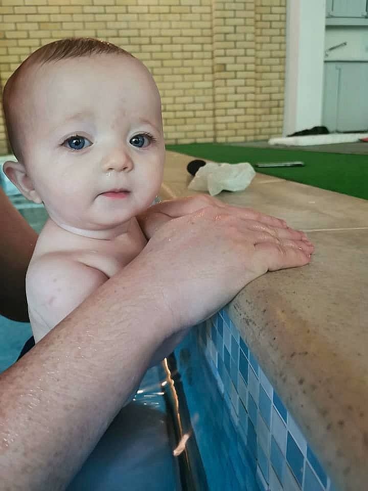 Cillian is registered to the contest to win money with this photo: arm, baby, baby_toddler_clothing, bathing, cheek, chest, child, eyebrow, eyelash, finger, gesture, hand, happy, iris, lip, nail, nose, person, skin, thumb