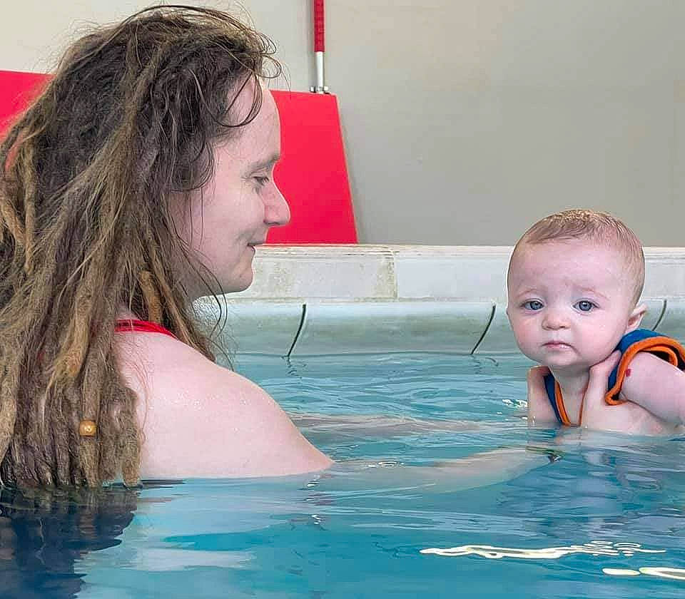 Cillian is registered to the contest to win money with this photo: baby, bathing, child, facial_expression, flag, fun, games, hair, hairstyle, happy, head, indoor_games_and_sports, joy, leisure, leisure_centre, person, recreation, summer, swimming_pool, toddler