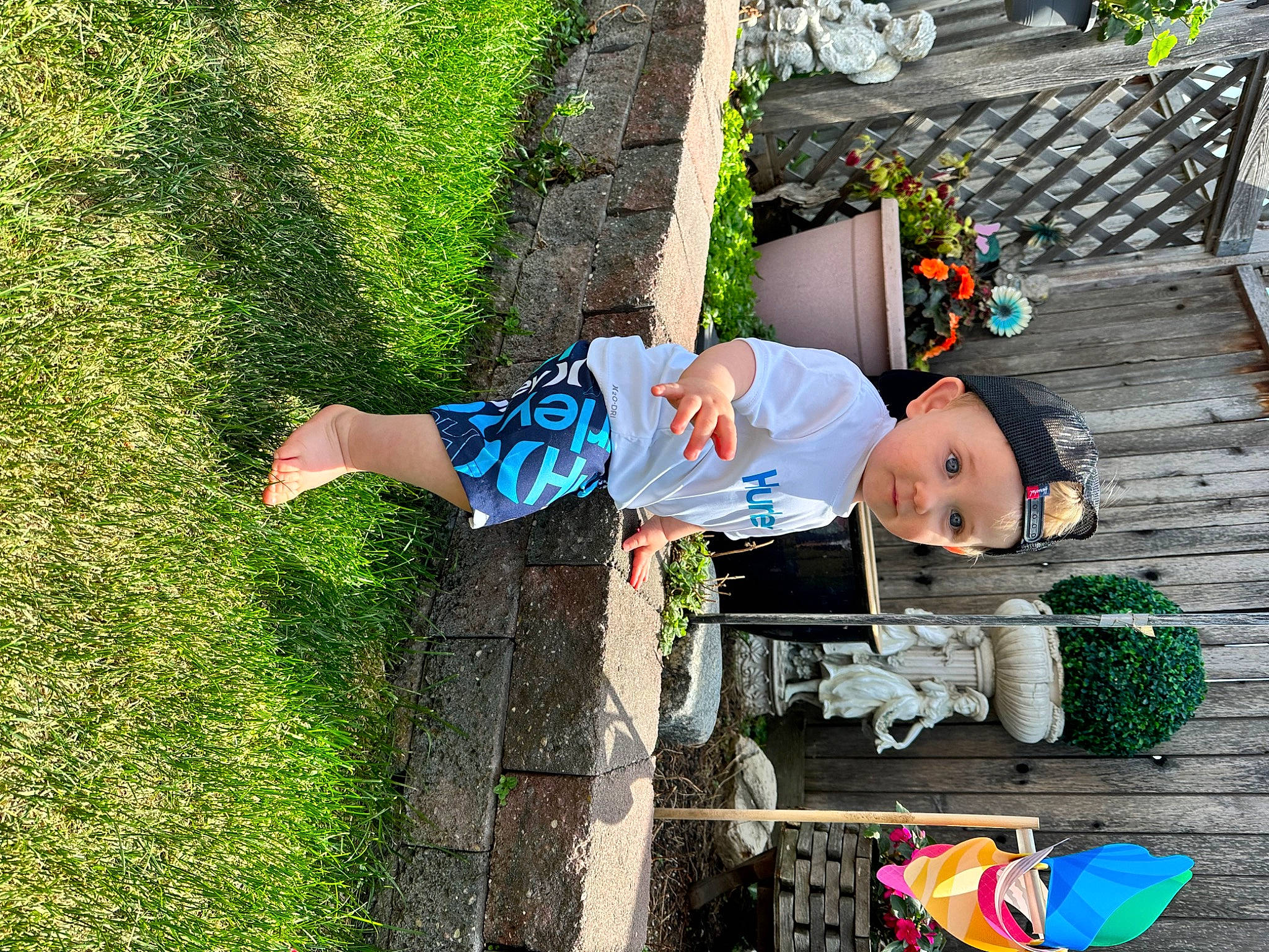 Braxtyn is registered to the contest to win money with this photo: baby, child, costume, electric_blue, fun, garden, grass, green, happy, hat, headwear, leisure, people_in_nature, person, plant, play, recreation, sitting, toddler, tree