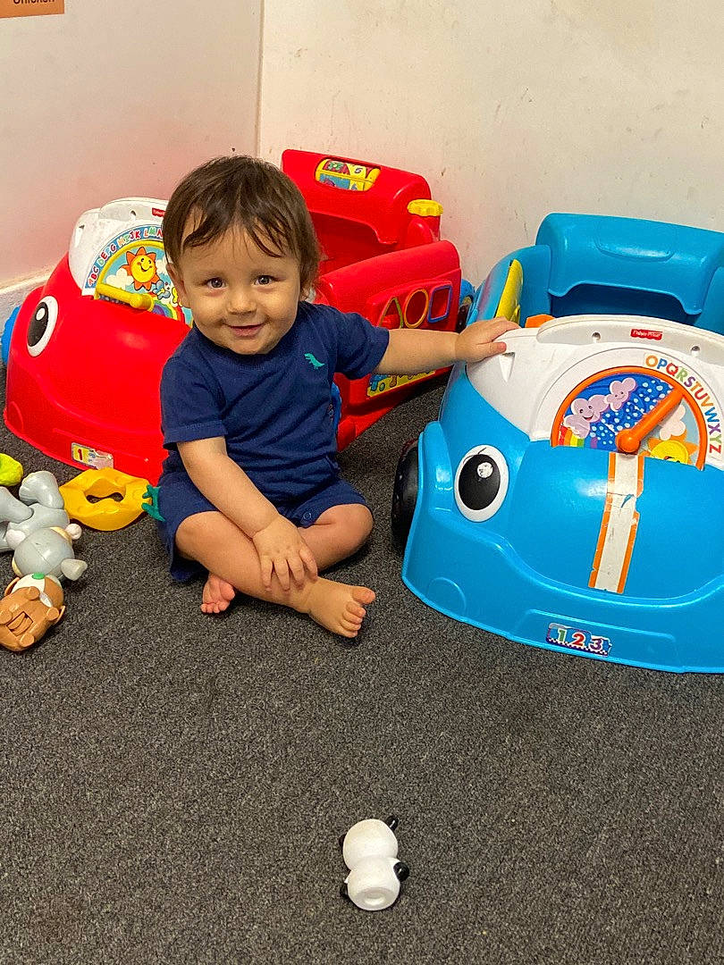 Callum joined the competition — help win amazing prizes! automotive_exterior, baby, baby_playing_with_toys, baby_toddler_clothing, baby_toys, child, flooring, fun, happy, joy, motor_vehicle, person, play, product, riding_toy, smile, tire, toddler, toy, toy_vehicle