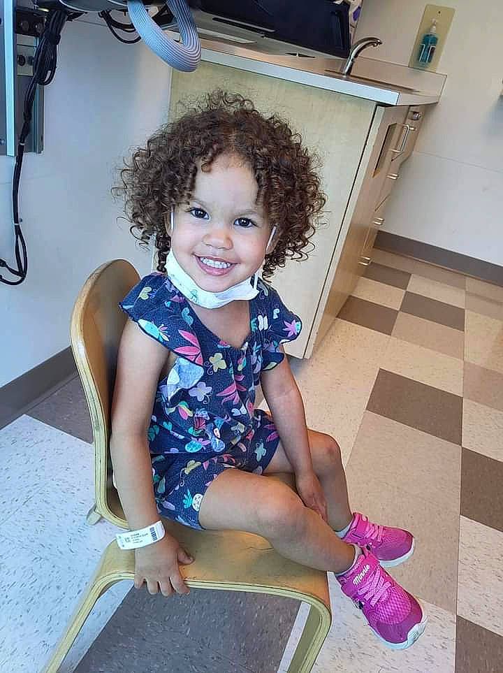 Camilla is registered to the contest to win money with this photo: baby_toddler_clothing, child, electric_blue, flooring, foot, fun, happy, home_appliance, human_leg, joint, joy, knee, leg, leisure, pattern, person, shorts, sitting, skin, smile