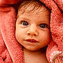 baby, close_up, face, portrait, towel, pink, child, cute, wet_hair, skin, eyelashes, expression, young, soft_texture, wrapped, innocent, indoors, looking, head, human