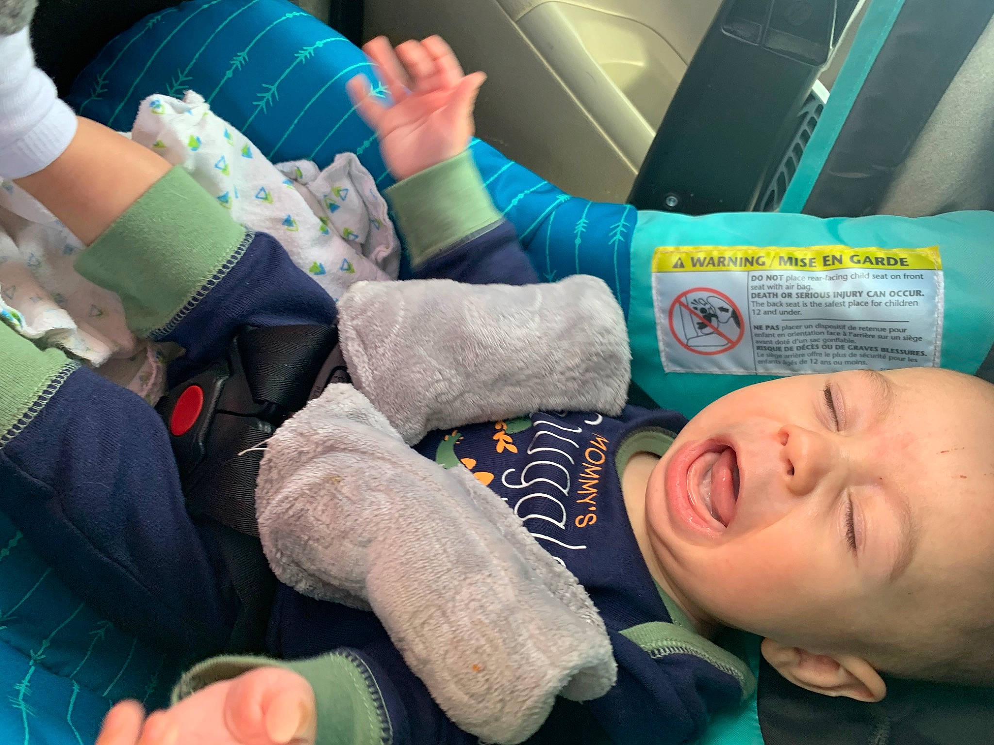 Link is registered to the contest to win money with this photo: baby, child, comfort, elbow, finger, fun, gesture, green, hand, human_body, human_leg, joint, knee, nail, person, sitting, sock, thigh, thumb, toddler