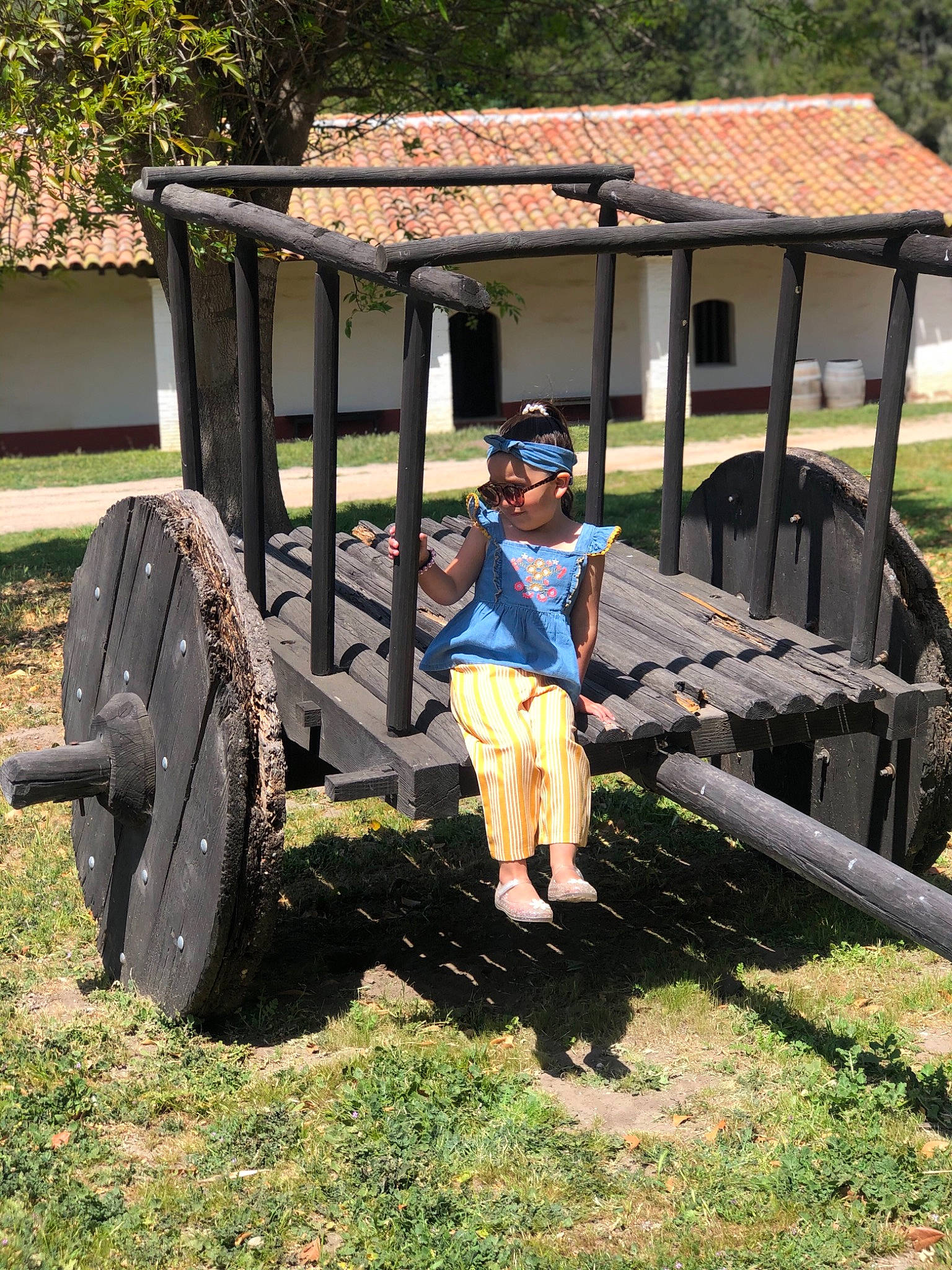 Camila is registered to the contest to win money with this photo: auto_part, automotive_tire, automotive_wheel_system, bicycle_helmet, grass, helmet, landscape, leisure, person, personal_protective_equipment, plant, recreation, rural_area, shade, shorts, soil, sunglasses, tire, tree, wheel