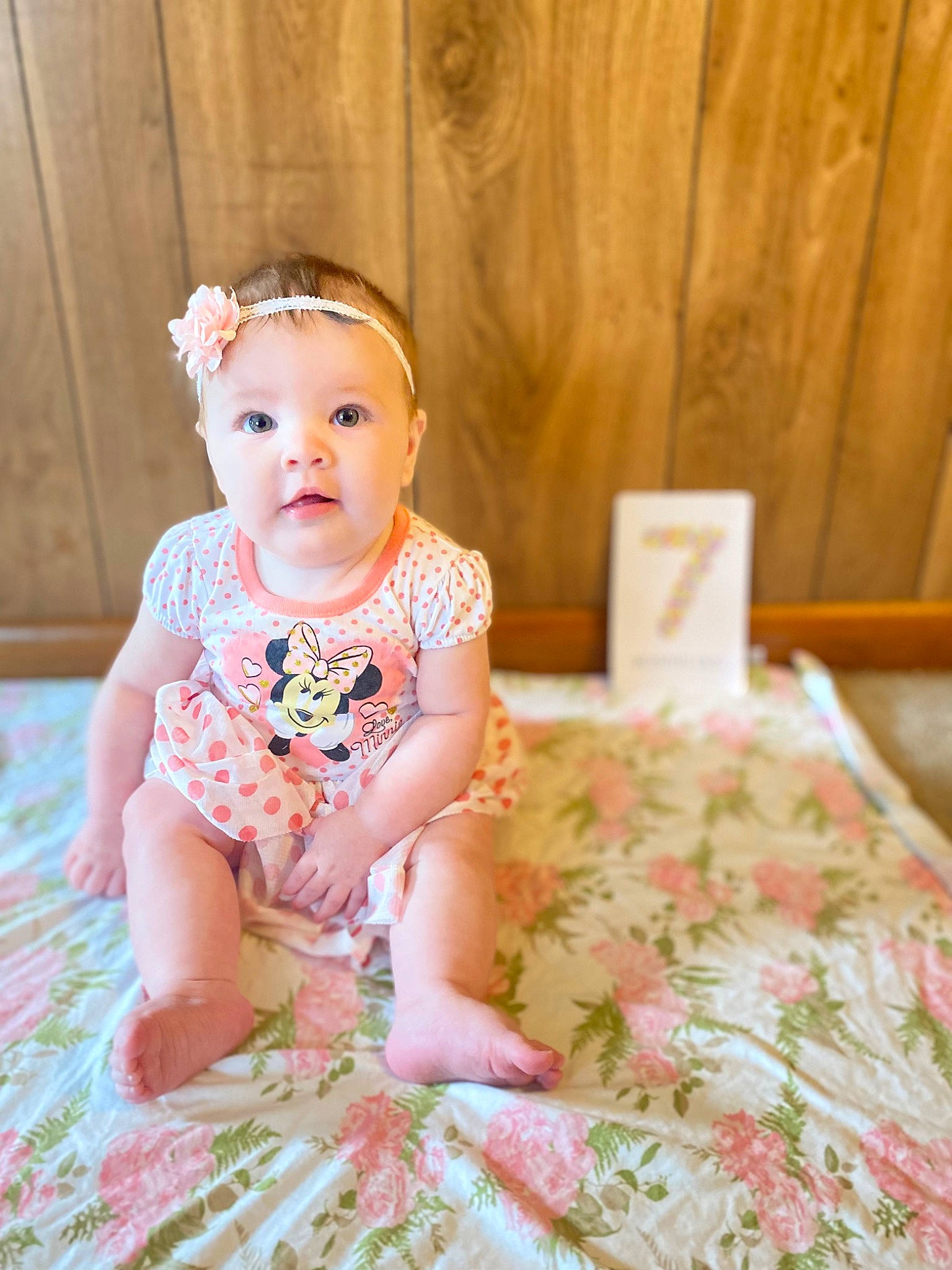 Emberly joined the competition — help win amazing prizes! baby, baby_toddler_clothing, cheek, child, dress, embellishment, eye, face, facial_expression, flooring, grass, happy, head, iris, pattern, person, pink, skin, sleeve, toddler