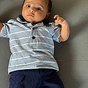 Gurfateh Singh joined the competition — help win amazing prizes! baby, child, infant, polo_shirt, shorts, couch, gray, patterned_clothing, indoor, portrait, person, young, face, skin, head, hands, legs, expression, casual, sitting