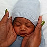 newborn, baby, sleeping, hat, hands, nails, green_nails, cozy, knit_hat, close_up, skin, face, peaceful, tender, protective, person, portrait, infant, resting, soft_light