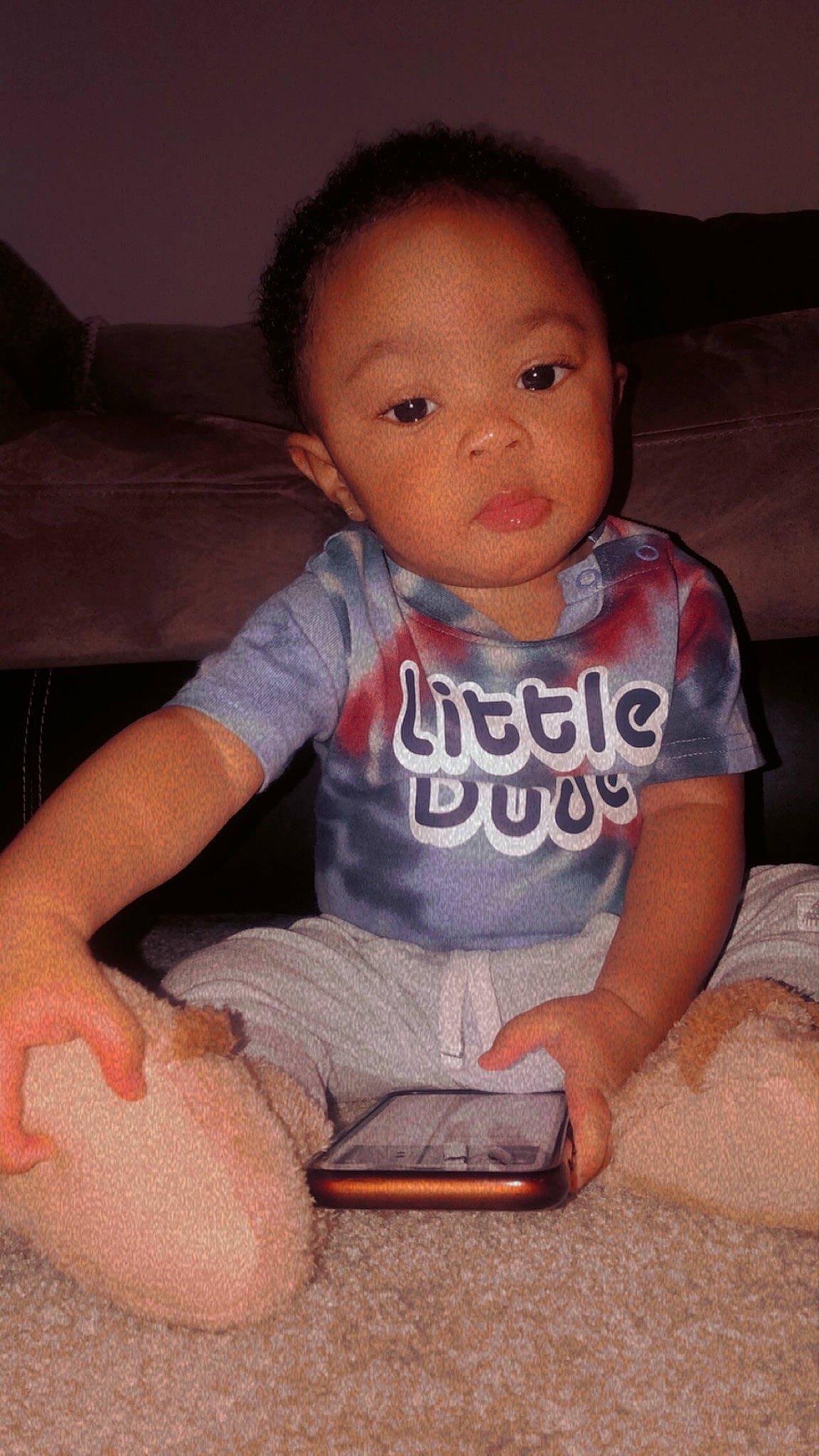 Hezekiah is registered to the contest to win money with this photo: arm, baby_toddler_clothing, cheek, chin, comfort, face, facial_expression, finger, flash_photography, forehead, hairstyle, joint, lip, mouth, neck, nose, orange, person, product, skin