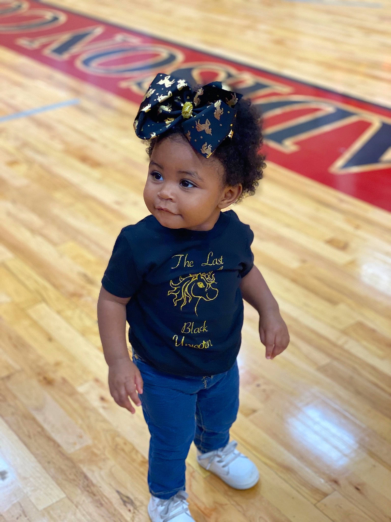 Nola is registered to the contest to win money with this photo: baby, blue, child, child_model, fashion_accessory, floor, flooring, footwear, fun, hair_accessory, happy, headband, headgear, person, photography, skin, standing, toddler, wood, wood_flooring